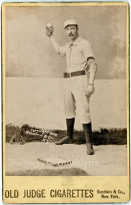 Doc Bushong throwing, on the 1888 Old Judge Baseball card.